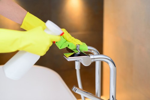 Cleaner vacuuming a family home in Ilford