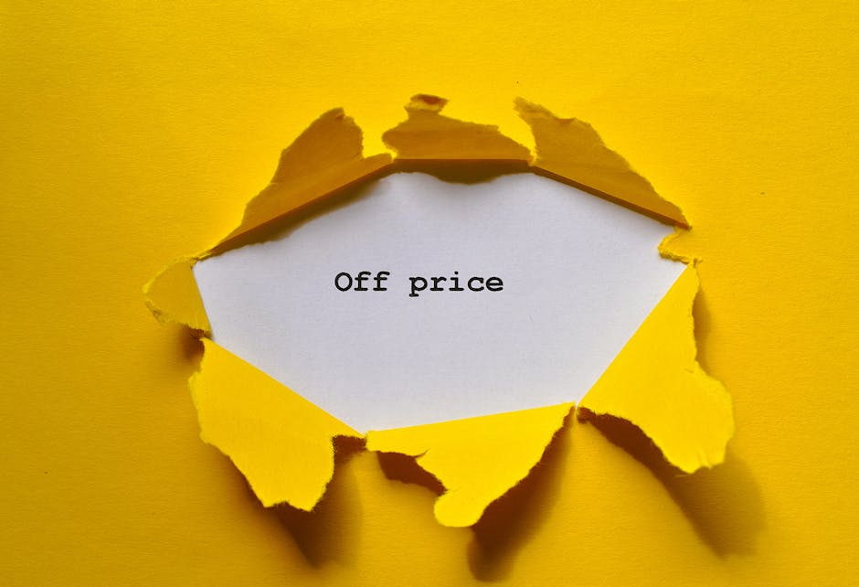 A torn yellow paper with jagged edges reveals a white note underneath, which displays the words 'Off price' in black type. The paper is set against a matching yellow background, creating a stark contrast that draws attention to the message. The torn edges suggest a sense of surprise or discount, fitting for promotional material related to cleaning quotes or special offers. The clean and simple composition emphasizes the message, while the lighting highlights the texture of the torn paper and the crispness of the printed text. This image is associated with Deep Cleaning Ilford's services, emphasizing affordability and value in domestic or commercial cleaning solutions.